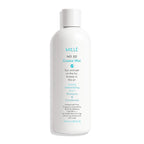 White bottle of MILè No. 02 Coastal Mist shampoo and conditioner on a white background