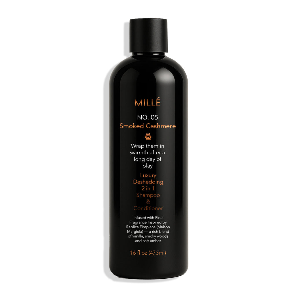 Black bottle of Mille No. 05 Smoked Cashmere Shampoo & Conditioner on a white background